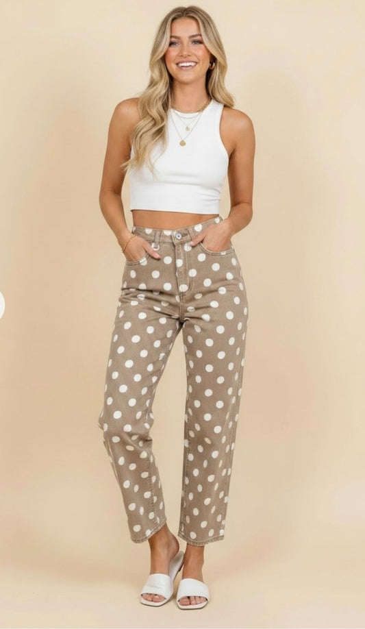 Model wearing taupe pants with white polka dots, a high-rise waist, and cropped straight legs.